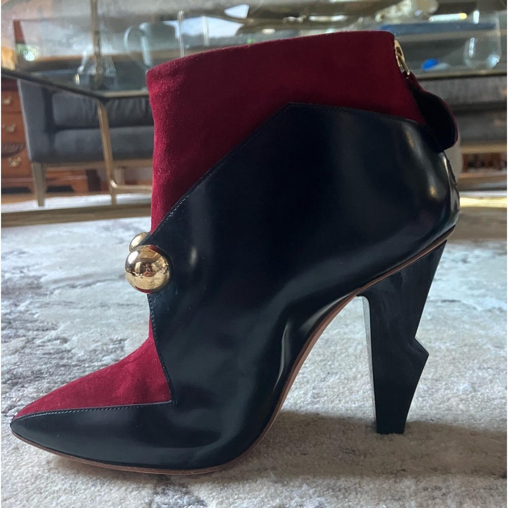 Red velvet with black and gold bar in between with zipper in the back